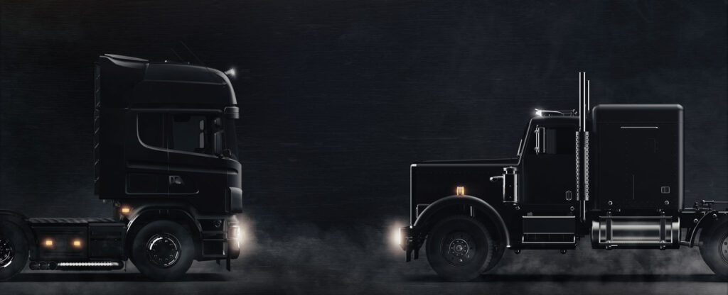 start a trucking business - two trucks facing dark background